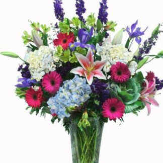 Tall vase mixed colorful flowers